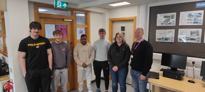 Past student Holly Johnston with Construction students and lecturer Simon Cummings